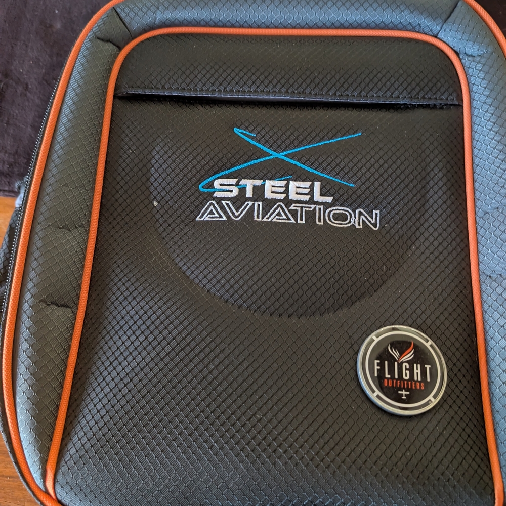 Steel Aviation Backpack with Orange Accents